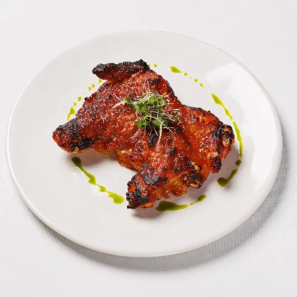 Zanzichicken grill on a white plate